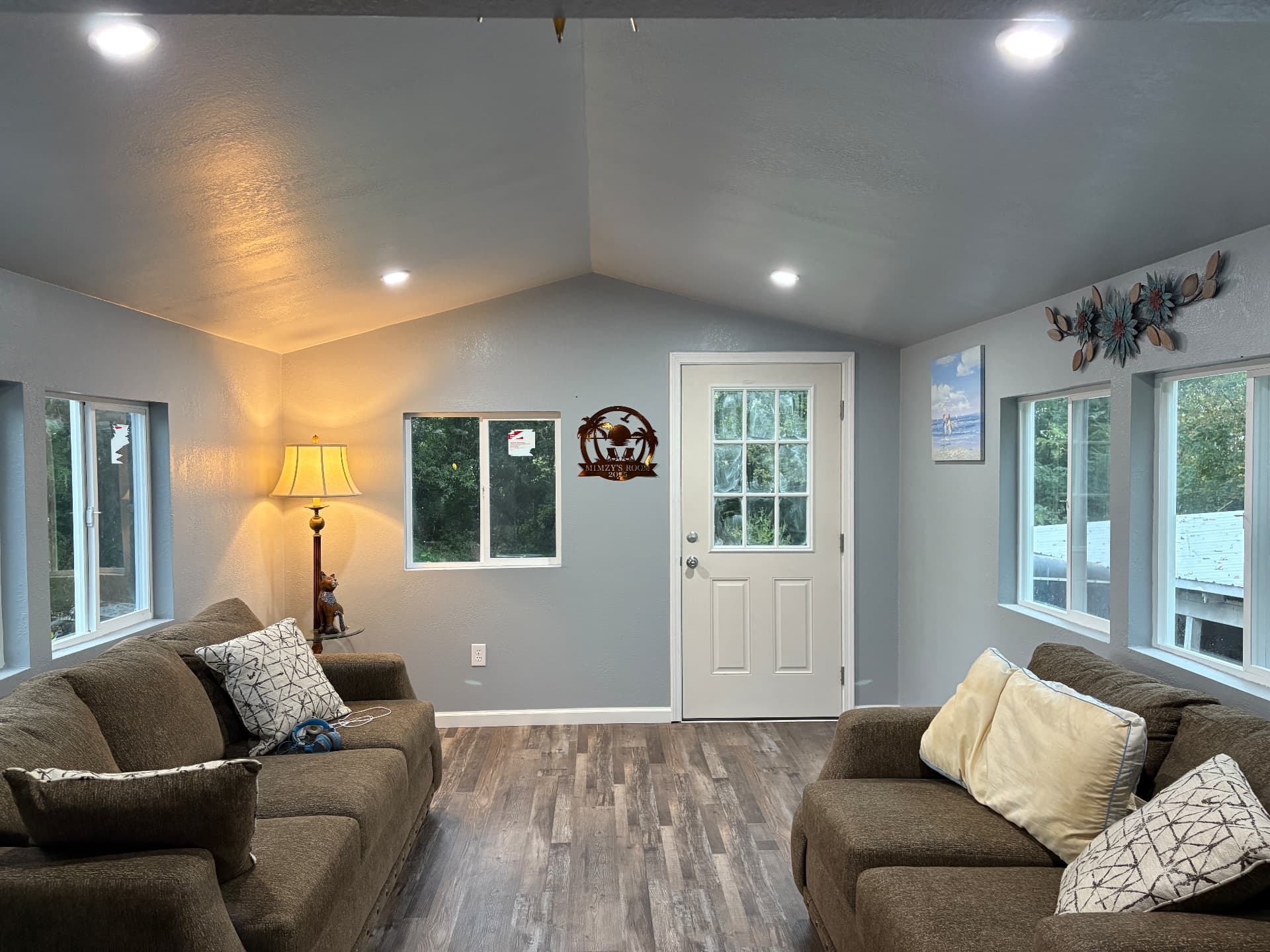 Vaulted-ceiling living room addition with gray walls and recessed lighting in Lexington, KY