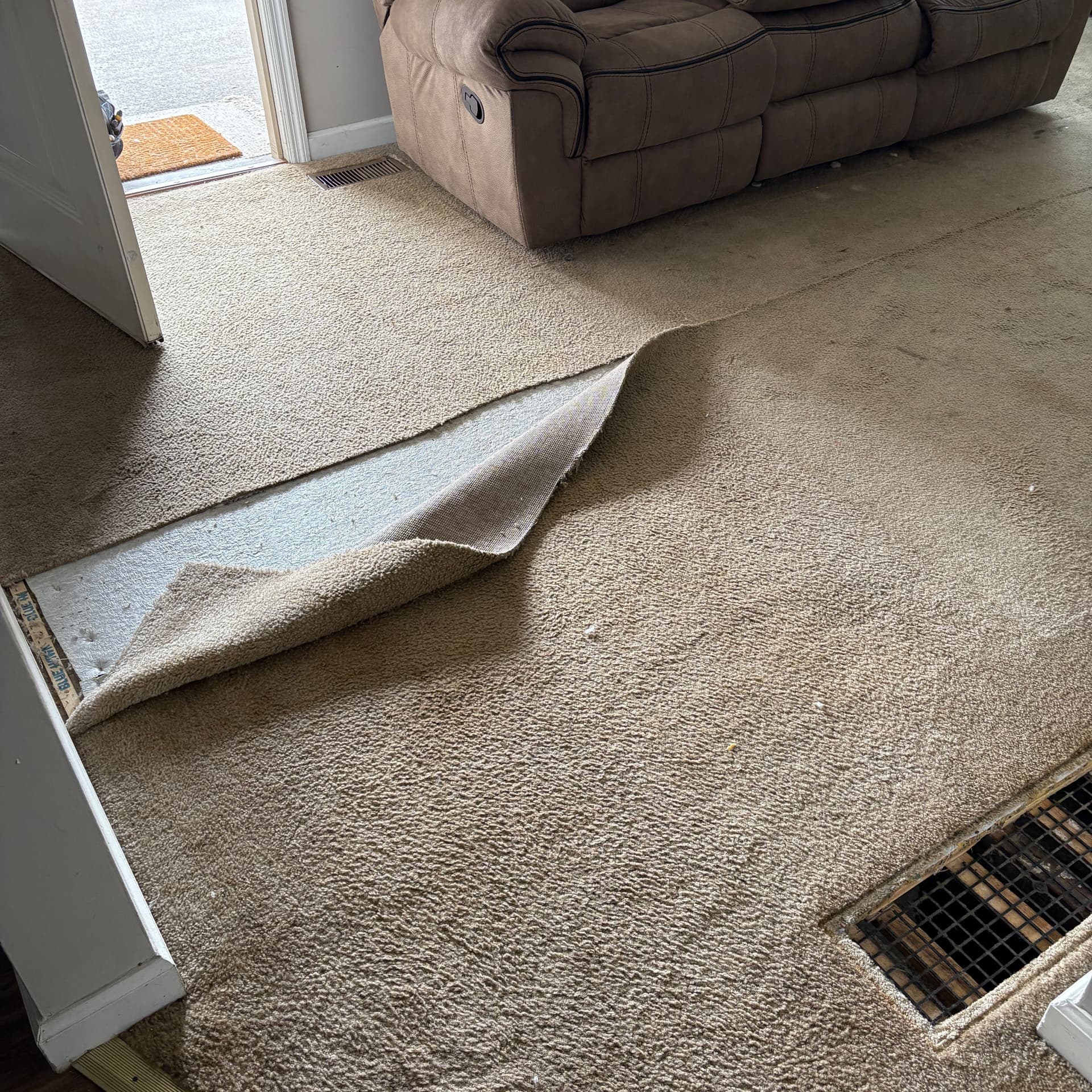 Carpet removal in progress, rolled back to the subfloor, in Frankfort, KY