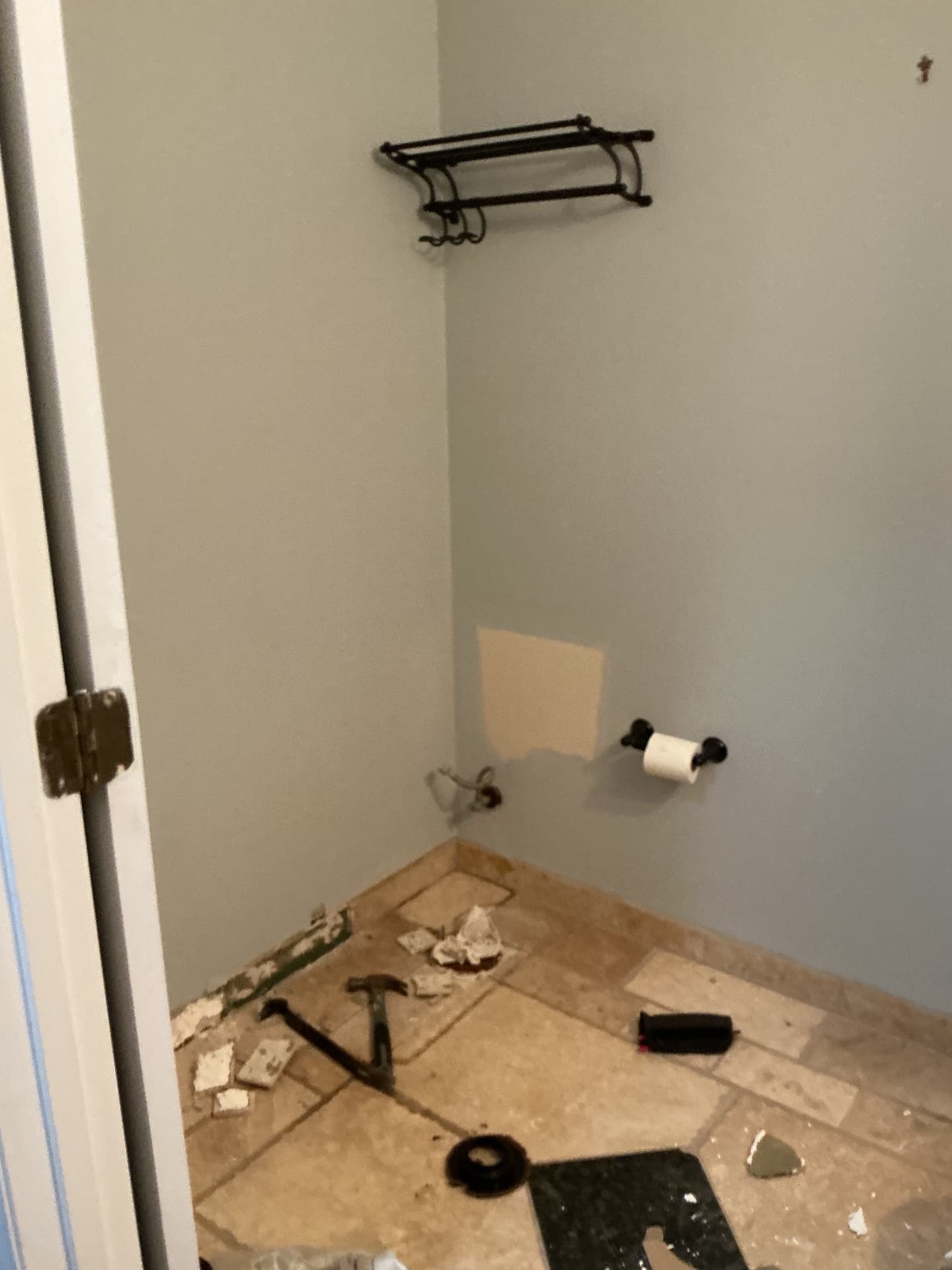 Bathroom gutted with toilet removed and old tile floor exposed in Georgetown, KY